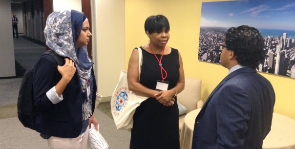  Samia Malik (left) compares notes with technologists at the Chicago School of Data conference.